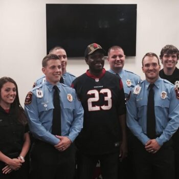 Photo of South Montgomery County Fire Department members and a civilian standing in the board room.