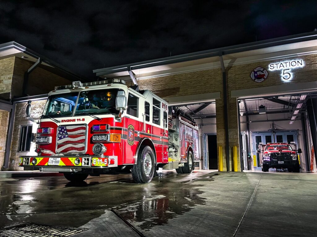 South Montgomery County Fire Department Station 11-5 building, showing Engine 11-5 parked in the front bay area at night.