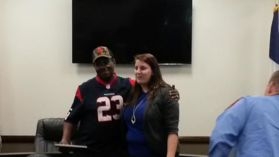 Photo of two civilians standing in the South Montgomery County Fire Department board room.